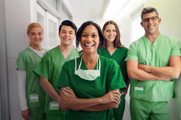Healthcare workings standing, smiling